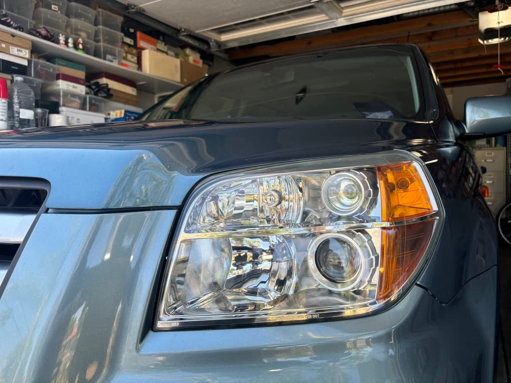 Clear, restored headlights on a car after service
